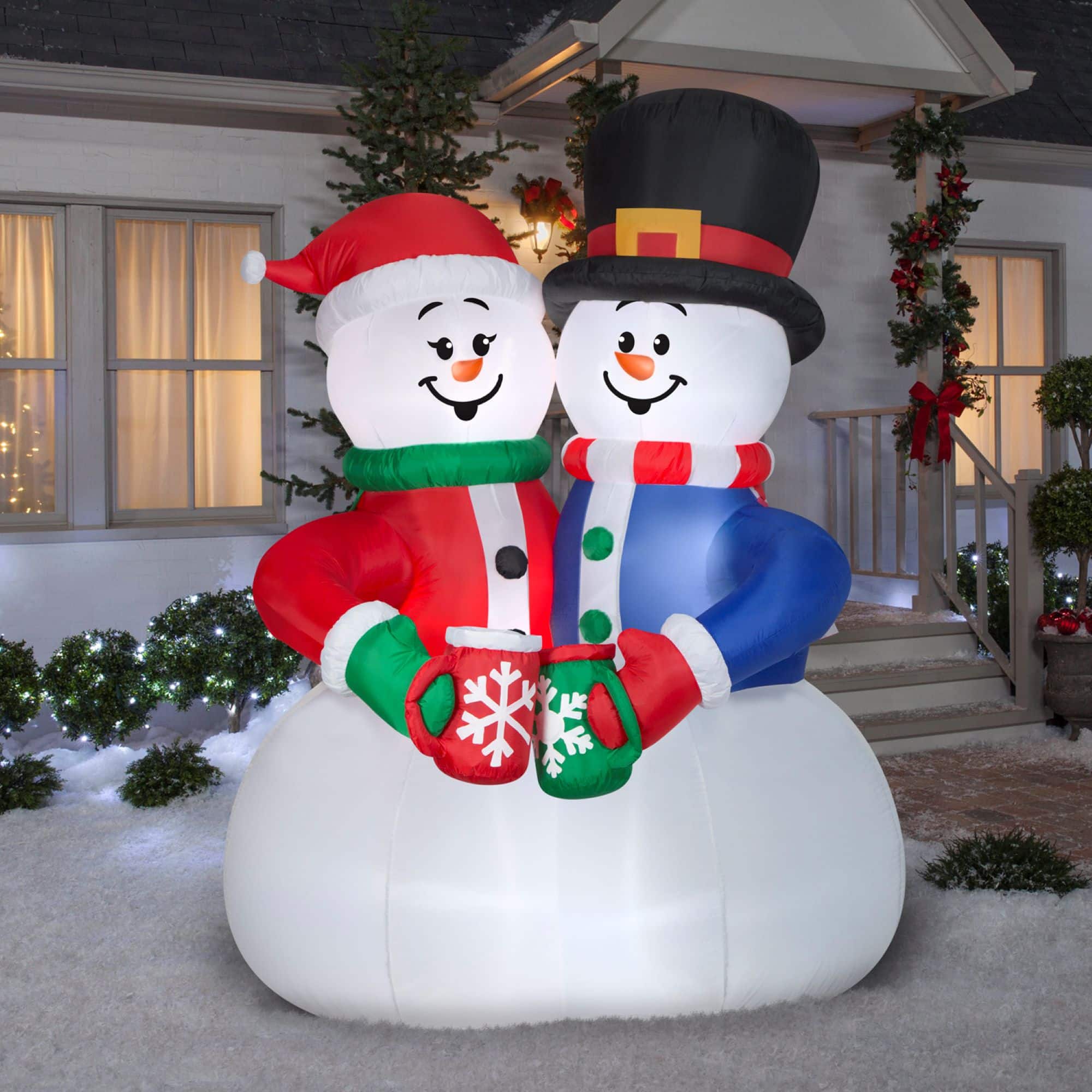 8ft. Animated Airblown® Inflatable Christmas Snow Couple Cocoa Cheers Scene
